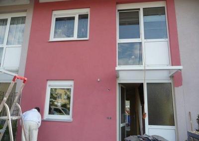 Streichen einer Fassade in Brandenburg